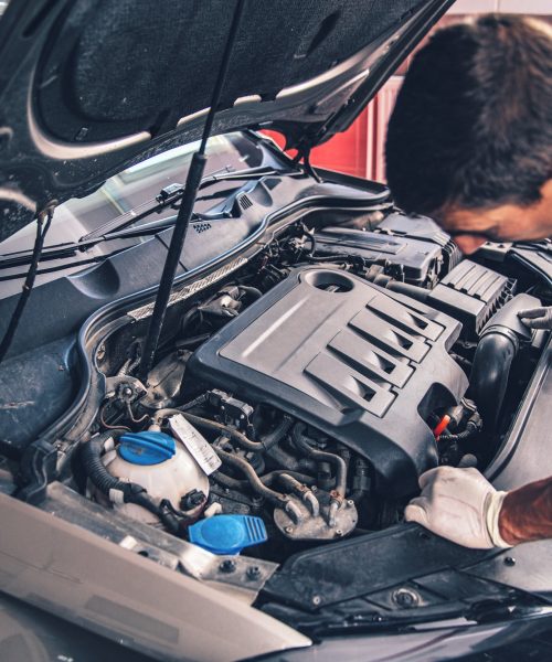 auto-mechanic-working-in-garage